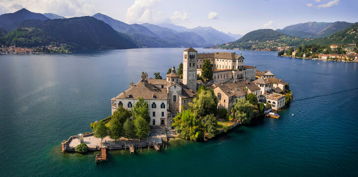 Most beautiful italian villages - unique romantic island San Giulio in Orta lake ( Lago di Orta) in Piedmont Province of Novara . aerial drone view