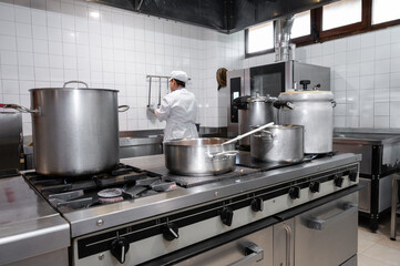Chefs cooking food in commercial kitchen. High quality photography