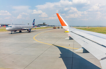 View from the airplane window during takeoff at Sheremetyevo airport at summer