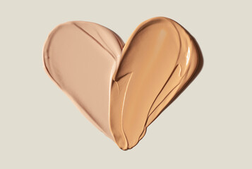 Heart shaped bb or cc fondation two tones cream swatch isolated on gray