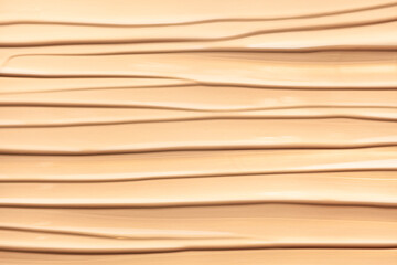 Texture of smudge cosmetic bb or cc cream foundation liquid background