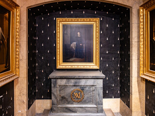 Marie-Antoinette Chapel in the Conciergerie, with her monogram and a portrait framed in gold....