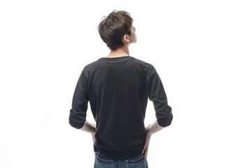 Fototapeta premium Young man looking up with hands in pockets isolated.