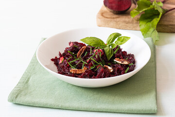 Healthy vegan beetroot salad with walnuts. Selective focus