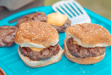 Selective focus background image of burgers grillin summer activitie