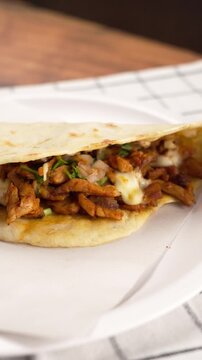 Vertical food video, a taco al pastor called gringa