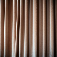 Obraz premium Curtain with soft smooth flowing folds. Deep beige color and luxurious texture create a dramatic and elegant atmosphere. Decoration and interior design. Expensive curtain made of rich fabric. AI