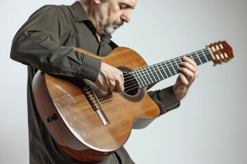 man playing a guitar  A man playing a guitar  standing isolated on white background