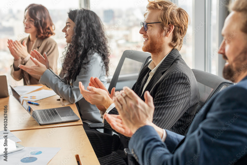 Aufkleber a group of business professionals sit at a table in a modern office, clapping their hands in appreci