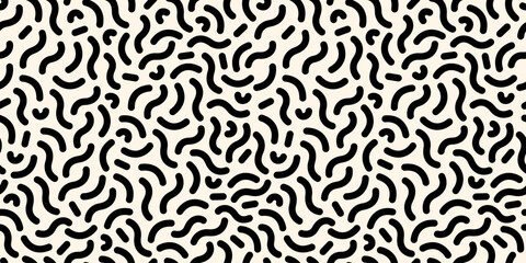 Fototapeta premium Seamless doodle-style pattern with abstract geometric grunge elements in black and white. Ideal for banners, postcards, ads, wallpapers, wrapping paper, and textiles. Memphis-inspired design.