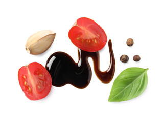 Delicious balsamic vinegar, tomato, basil, garlic and peppercorns isolated on white, top view
