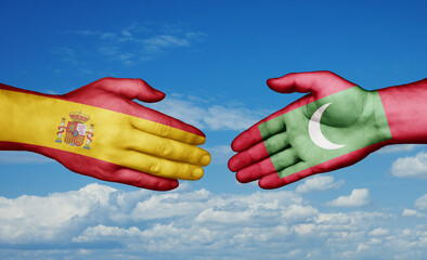 Maldives and Spain country handshaking with flags, consensus concept international co-operation illustration