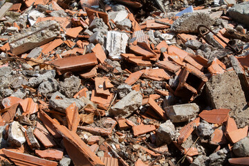 Construction waste at the dump. Small pieces of concrete and brick