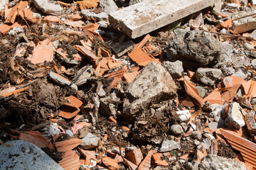 Construction waste at the dump. Small pieces of concrete and brick