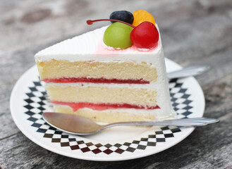 piece of beautiful cake on dish with fresh fruits