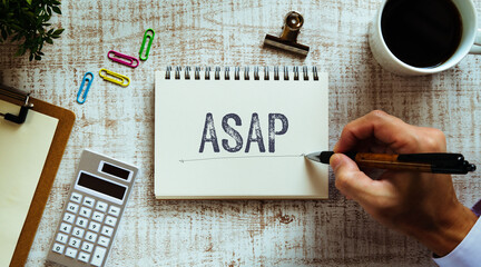 There is notebook with the word ASAP. It is as an eye-catching image.