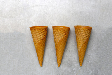 Waffle cones on grey background