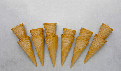 Waffle cones on grey background