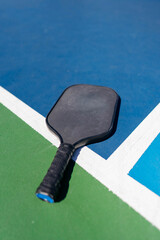 closeup of pickleball paddle on a sunny day