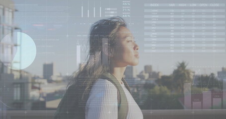 Image of financial data processing over biracial woman on the go