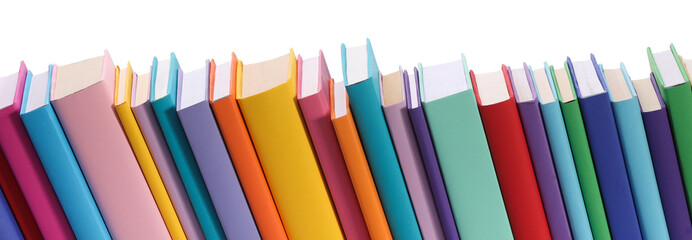 Many bright colorful books against white background