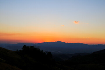 Fototapeta premium Mountain sunrise landscape orange sky in the morning Amazing nature scenery. Tourism and travel concept