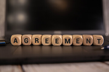 word agreement on wooden block
