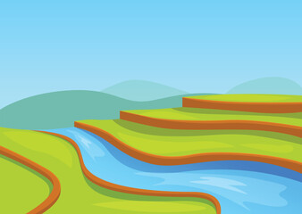 Obraz premium Blue river winding through green rice paddy fields on a sunny day