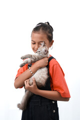 a little asian girl holding a kitten with love, cute. Isolated on white background. international cat day photo concept.