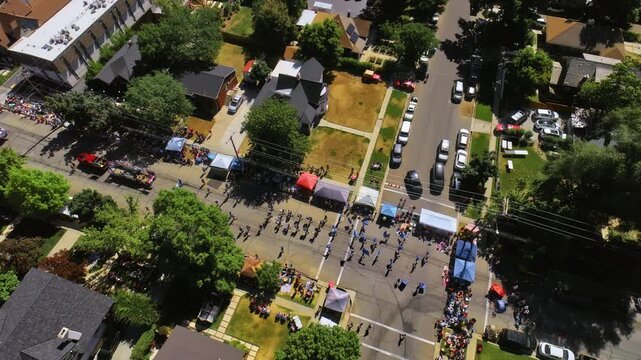 Flying high over parade on neighborhood road in Provo, Utah