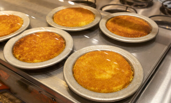 Knafeh Food, Sweet Cheese Pastry Made With Kadaifi, Traditional Arabic Dessert. Delicious Turkish Delight Kunefe On Metal Plate Behind Glass Case. Selective Focus, Horizontal Plane,