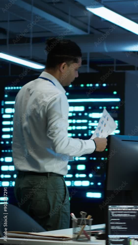 Poster vertical video admin in data center working with colleague to maintaining accurate documentation of 