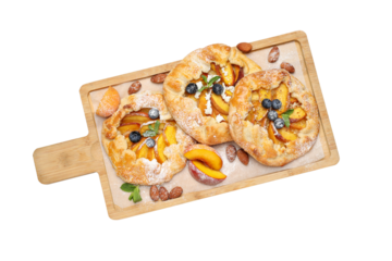 PNG, Fruit galettes on wooden kitchen board, isolated on white background, top view
