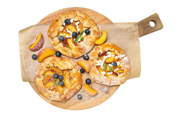 PNG, Fruit galettes on wooden kitchen board, isolated on white background, top view