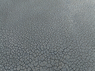 Aerial and top angle view of cracked and dried mud flat on the reclaimed land of Unyeomdo Island at Yeongjongdo near Incheon, South Korea
