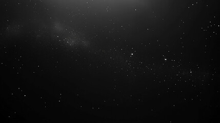 Fototapeta premium A dark sky with scattered stars and a band of the Milky Way.