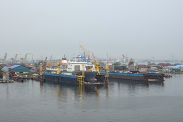 Fototapeta premium Container Ship Docked In The Port For Loading And Unloading Containers
