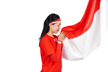 Indonesian woman celebrating Indonesia's independence day on 17 August by holding the Indonesian...