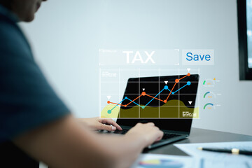 Fototapeta premium Women work in the office use laptop for work E-tax, Businesswomen show TAX for Individual income tax return form online for tax payment concept.