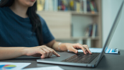 Business financing accounting banking concept. Businesswoman hand doing finances and calculate on desk about cost at home office.