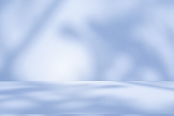 Studio style background wall decoration presentation uses white and blue tones. with shadows cast from a nearby window, concept creating a decorative backdrop.