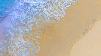 op view beach sand background for summer vacation concept. Beach nature and summer seawater with sunlight light sandy beach Sparkling sea water

