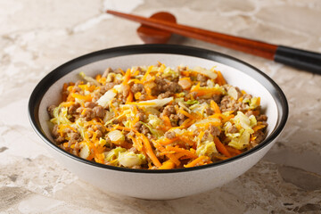 Eggroll in a bowl with coleslaw mix and ground beef closeup on the table. Horizontal