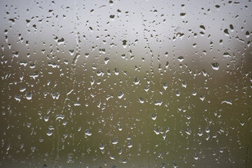 Window glass surface covered by water droplets