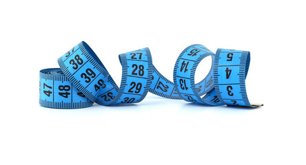 Blue measuring tape curled on white background representing fitness and precision