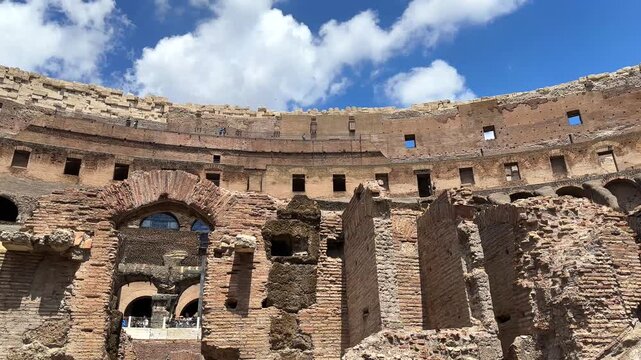 Pan from the underground catacombs of the ancient Roman Colosseum, Rome, Italy during the day