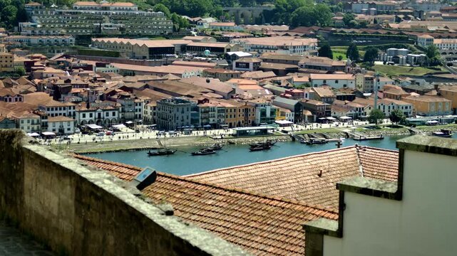 Shot of the river with boats and buildings in Porto, Portugal.