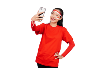 An Indonesian woman celebrating Indonesia's independence day on 17 August while holding smartphone with blank screen isolated transparent