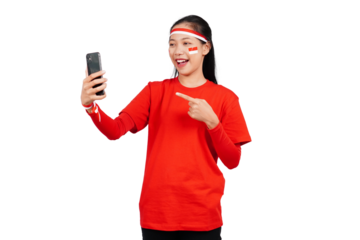 An Indonesian woman celebrating Indonesia's independence day on 17 August while holding smartphone with blank screen isolated transparent