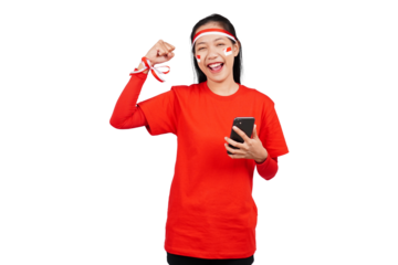 An Indonesian woman celebrating Indonesia's independence day on 17 August while holding smartphone with blank screen isolated transparent